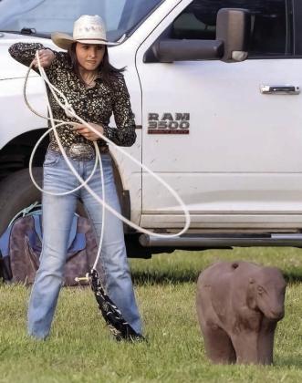 One of the young cowgirls practices roping a calf. (LEIGH LOFGREN/Staff)