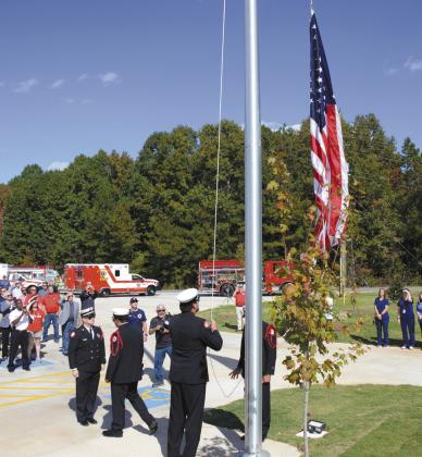 The Putnam County Fire Department Color Guard handled the first official raising of the flag at the new station IAN TOCHER/Staff