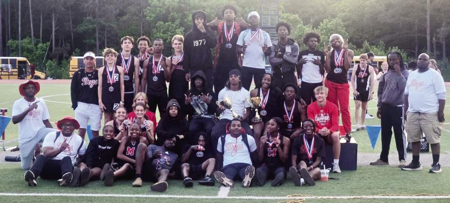 The Morgan County track and field teams pose for a photo after sweeping the Region 4-AA meet, capturing both the boys and girls team titles. CONTRIBUTED