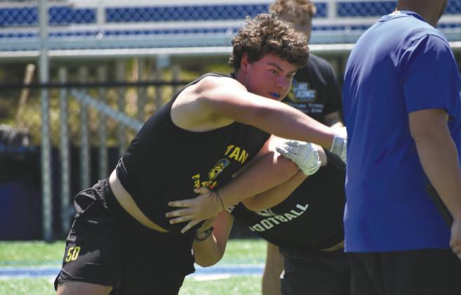 LOA offensive and defensive lineman Logan Davis works through a drill. CONTRIBUTED