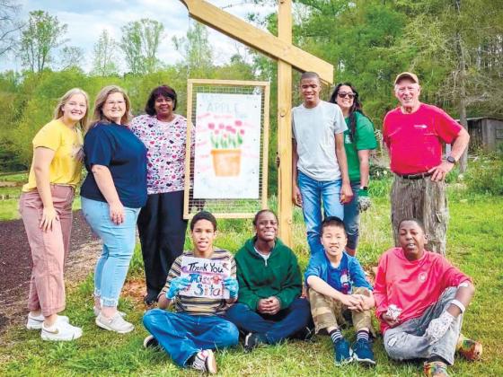 Student-teacher Taylor Casey (far left) worked closely with APPLE teacher Carla Dabbs (in sunglasses) to bring Putnam County Middle School students to Eatonton’s Butterflies and Blooms habitat. CONTRIBUTED