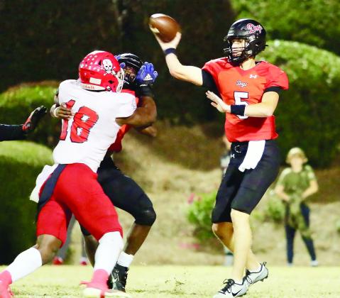 Davis Strickland (5) gets ready to deliver a pass in a Class AAA second-round state playoff game between Morgan County and Savannah Christian on Nov. 17.