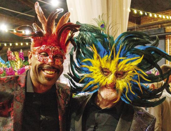 Guests came dressed to impress with festive Mardi Gras masks against a backdrop of colorful decor. EMMA CLAUSE/Staff