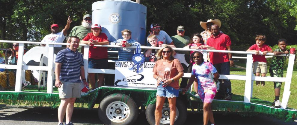 Eatonton-Putnam Water &amp; Sewer won first place in the float competition with their float showing off a water tank that is decorated with cows grazing around it. BAILEY BALLARD/Staff