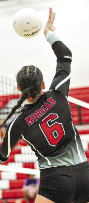 Morgan County junior Quinn Butler (6) gets up at the net to try and get a kill against Academy of Richmond County last week. CHARLES JORDAN/Staff