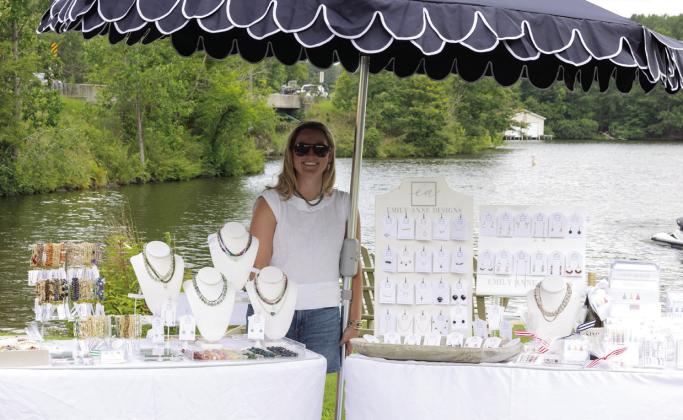 Emily Schnieder of Emily Anne Designs with her lovely selection of jewelry was one of the vendors at the event.  LEIGH LOFGREN/Staff
