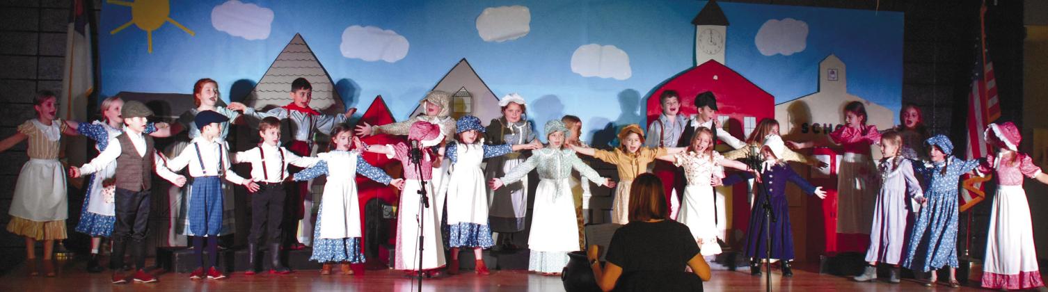 Young Gatewood students perform An Dro Retournee, a French folk dance, in the final act of “Stone Soup.” LENA HENSLEY/Staff