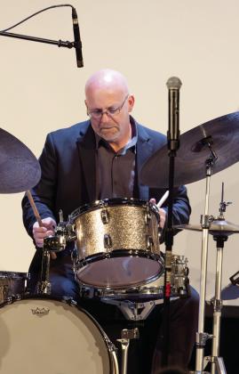 JLP drummer and event narrator Justin Varnes. LEIGH LOFGREN/Staff