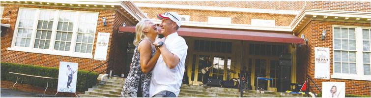 At least one happy couple outwaited the wet stuff to share a dance to the sounds of Cash’s Juke Joint, playing Saturday afternoon on the steps of The Plaza Arts Center in Eatonton.