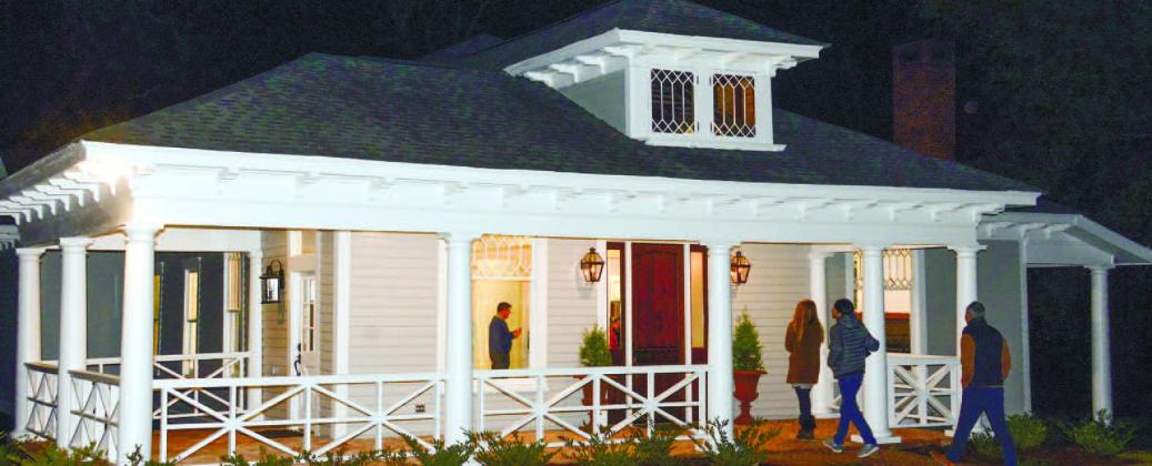 Curious visitors arrive on a cool November night last year to tour the recently refurbished home on Eatonton’s Wayne Street.