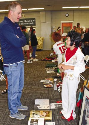 Dressed as Elvis Presley, Clyde Thrift answers questions about his character from Matt Miller.