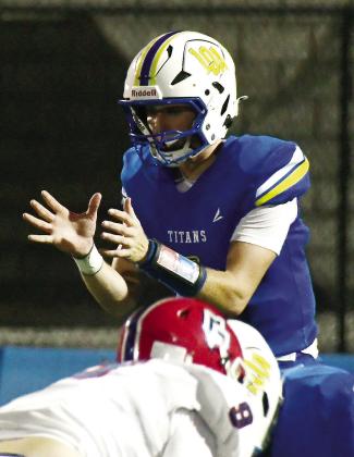 Titans junior quarterback Jake McDonald calling a snap in the team’s pre-season scrimmage at home in August. IAN TOCHER/Staff