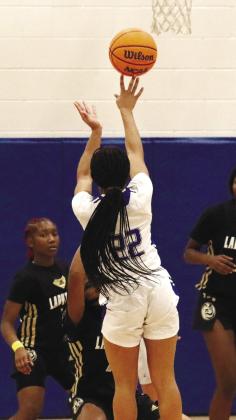 Lady Titans’ senior Jada Williams (22) attempts a 3-pointer from the top of the key in a win over Greene County on Friday, Jan. 6. BRENDAN KOERNER/Staff
