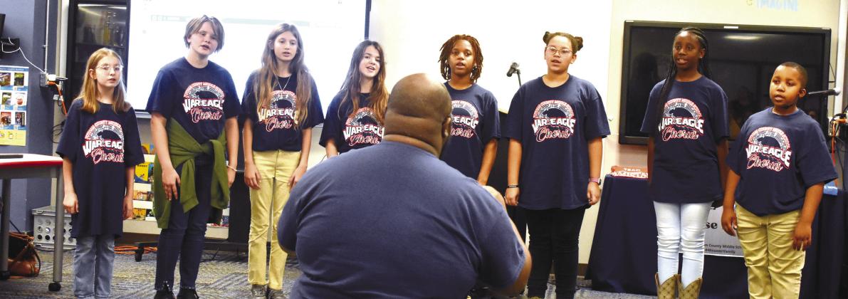 Chorus teacher Ontario Williams leads sixth grade chorus members in singing ‘Color of the Wind’ from the Disney movie Pocahontas. BAILEY BALLARD/Staff
