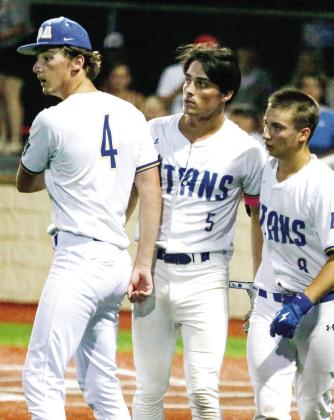 Jon Harris Funderburke (4), Dylan Hiter (5) and Braxton Bragg (8) walk off the field after Charlton County clinched the series with a 9-6 victory in Game 2. LANCE McCURLEY/Staff