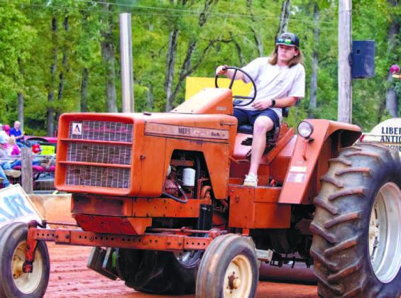 Bryson Freeman drives the track on his tractor and has been pulling since he could walk. His other passion is football.