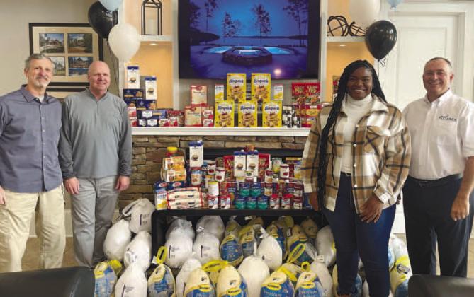 The Alliance Home &amp; Land Group donated 48 turkeys and non-perishable food to Putnam Christian Outreach and the Greene County Food Pantry. CONTRIBUTED