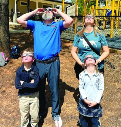 The Parrish family – Justin, Jennifer, Knox and Harper – safely view the celestial event.