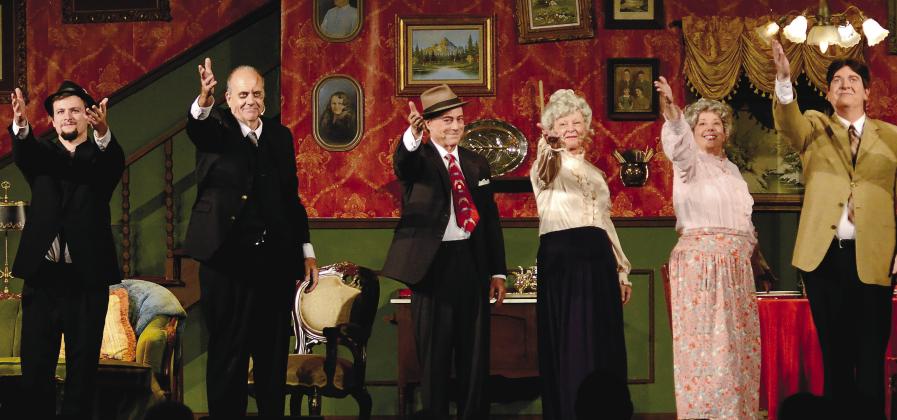 Actors (l-r) Michael Alexander, Arthur Shutt, Michael Homeier, Debbie McCown, Rusty Faulk and Drace Langford salute the crowd after presenting “Arsenic and Old Lace” Nov. 5 at Festival Hall in Greensboro.