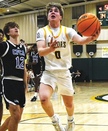 Then an eighth grader, Bennett Haley attempts a layup through traffic during a game in the 2025-26 season. IAN TOCHER/Staff