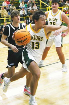 Landon Moreno drives the baseline past a defender during a game in the 2025-26 season. IAN TOCHER/Staff