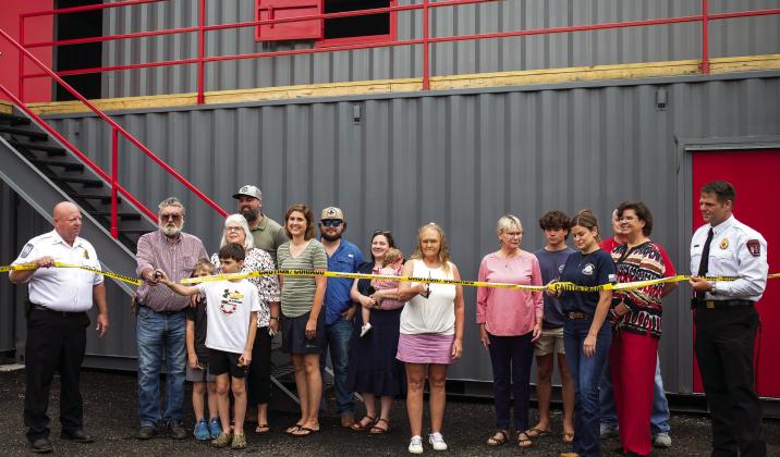 The MCFR named its new Fire Training Academy after former Morgan County Firefighters Chris Eddy, Chris McGlauchlen, and Keith Arnold. Their families cut the ceremonial ribbon on Monday morning in their honor. SKYLA MORRIS/Staff