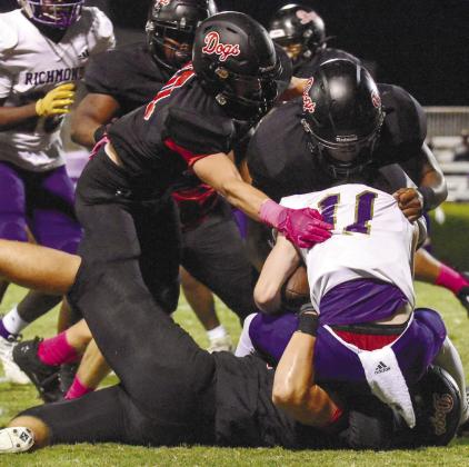 A pack of Morgan County defenders sack ARC quarterback Brooks Dickinson on Sept. 29. LANCE McCURLEY/Staff