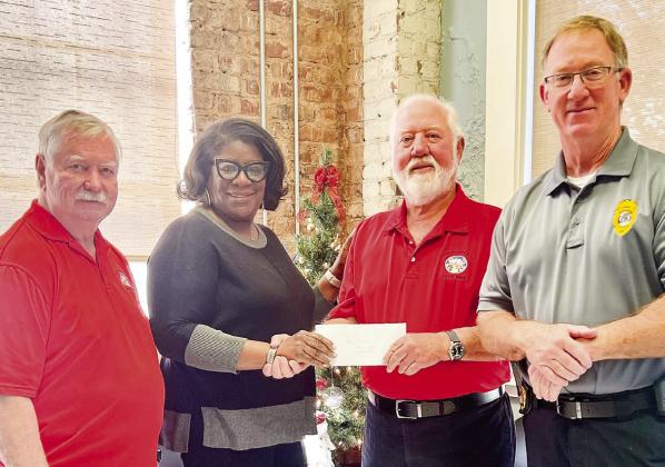 Madison Morgan Community Food Bank, L-R: Bill Lewis, Food Bank Director Sherry Terrell, Barry Bishop and Madison Police Chief Bill Ashburn.