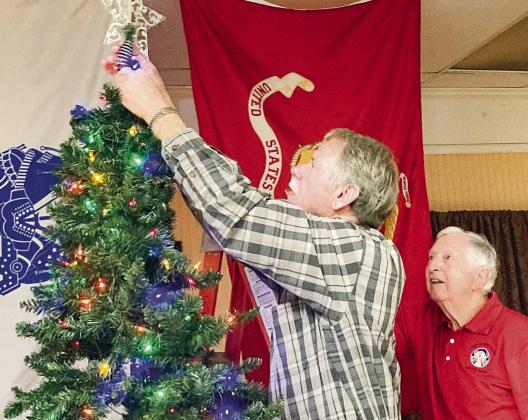 Tree decorating with Elks Fred Thyer and Mike DePetrillo.