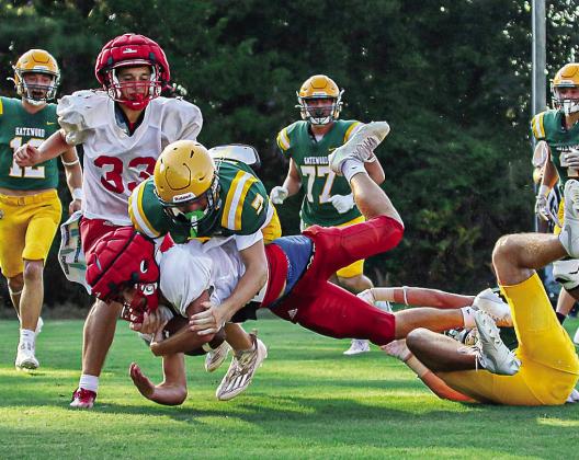 A pair of Gator defenders bring down an Edmund Burke Academy ball carrier in the open field. TREY NORRIS/Staff