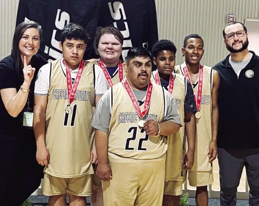 (L to R): Coach Amber Conoly with basketball players Nelson Martinez, Cassie Warwick, Luis Lucio-Gomez, Tyreese Hill, Marques Stembridge, and assistant coach Brad Evans. CONTRIBUTED