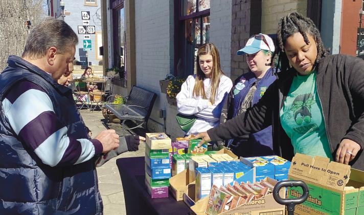 Local Greensboro Girl Scout Troop had a busy afternoon selling their famed cookies. MAUREEN STRATTON/Staff