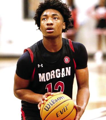 Morgan County freshman Trey Carter (12) has stepped up in his first year at the varsity level as a role player for the Dogs. LANCE McCURLEY/Staff