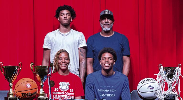 Kobi Jefferies (front row, right) recently signed to continue his basketball career at Denmark Technical College. CONTRIBUTED