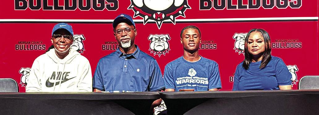 Morgan County senior Jacoby Simmons (second from right) recently signed to continue his basketball career at Southern Wesleyan University in South Carolina. CONTRIBUTED