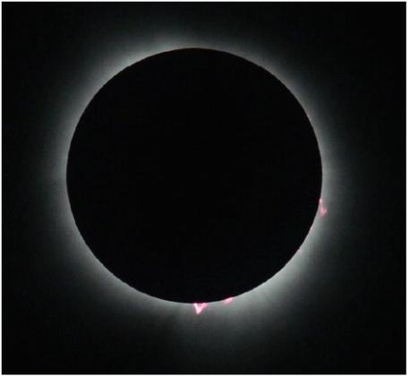The Sun and Moon line up perfectly during totality April 8 near Carbondale, Ill. The solar flares along the Sun’s perimeters are called prominences, which can extend as far as 60,000 miles from the surface of the Sun.