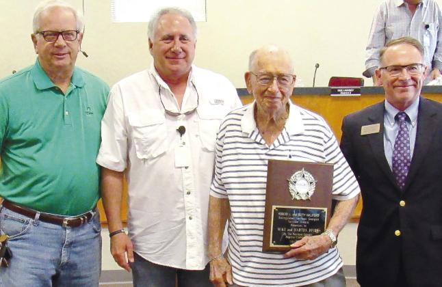 Former Greene County Board of Education Chairman Mike Jones (third from left) was presented the Robert L. & Betty Williford Distinguished Northeast Georgia Service Award at Tuesday’s Greene County Commission meeting. MARK ENGEL/Staff