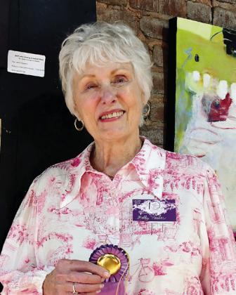 Artist Holly Parker received the prestigious People’s Choice Award for her painting Never Never Land, determined through votes by attendees during the show at Barrel 118.  IAN TOCHER/Staff