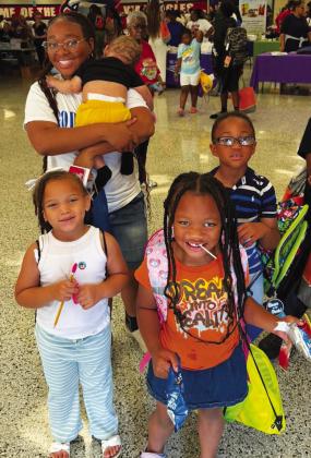 Happy families enjoyed the Reach 2 Teach Back-to-School Bash and Community Health Fair, held last Saturday at Putnam County Elementary School. CONTRIBUTED