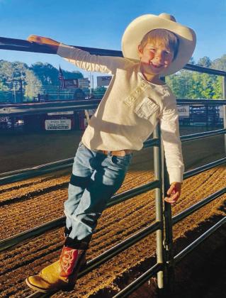 Both sides of the arena were full Saturday night to see the many events of the popular rodeo. Four-year-old David Edwards from Woodville enjoyed the rodeo with his grandpa this year.