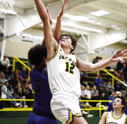 The thousandth point in action! With this score against Trinity Christian, Gatewood’s Matt Allen (12) put the final two points on the board to earn him membership in the exclusive 1,000-points club. As a sophomore, Allen still has plenty of time to add to his career total, too. IAN TOCHER/Staff