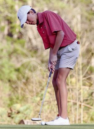Morgan County sophomore Drew Eidson attempts a long putt on the green. CONTRIBUTED
