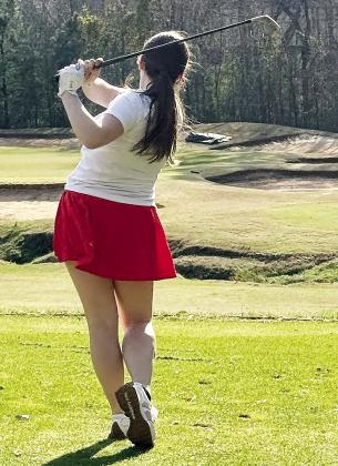 Morgan County junior Hailey Westmoreland takes a shot from the fairway. CONTRIBUTED