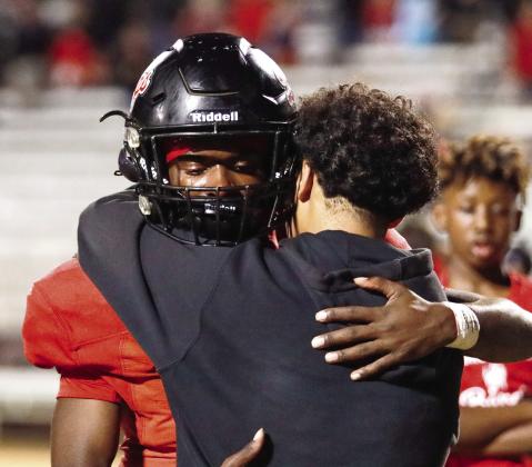 Morgan County senior running back Jay Dorsey hugs a friend after the loss. LANCE MCCURLEY/Staff