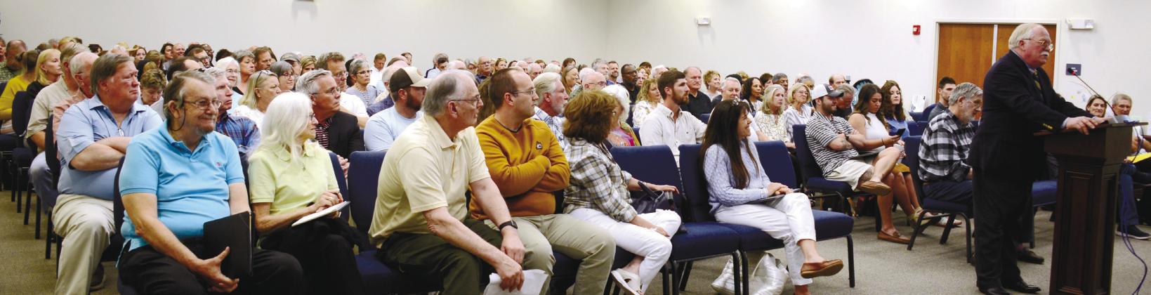 Putnam County Sheriff Howard Sills (at podium) was the first to speak in front of a crowded meeting about short-term rentals last Thursday at the county commission building last Thursday. IAN TOCHER/Staff