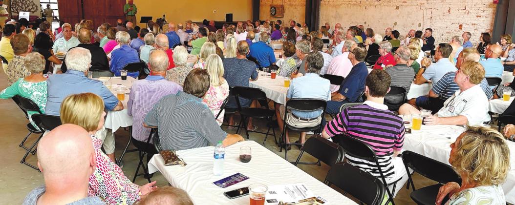 The name change was announced Tuesday night at a membership meeting held at Oconee Brewing Company. Some recipients spoke to the group about how the organization has helped their lives. MARK ENGEL/Staff