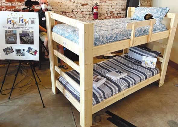 One of the group’s projects is to build and donate new beds, including pillows and sheets, to families whose children sleep on the floor or must share beds with other siblings. MARK ENGEL/ S t a ff