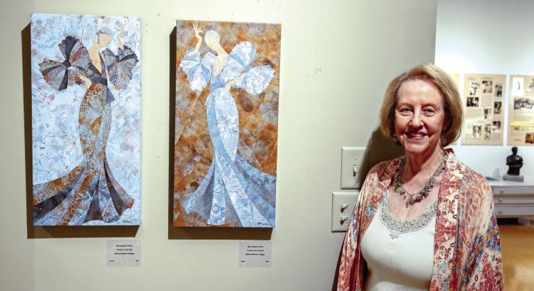 The daughter of Steffen Thomas and Sara Douglass Thomas, Lisa Conner, with some of the artwork in the museum. LEIGH LOFGREN/Staff
