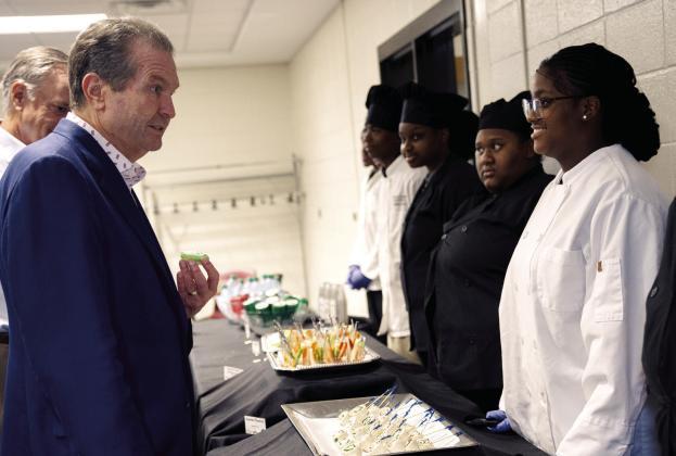 Gubernatorial candidate Rick Jackson engages with GCCA culinary students. CONTRIBUTED