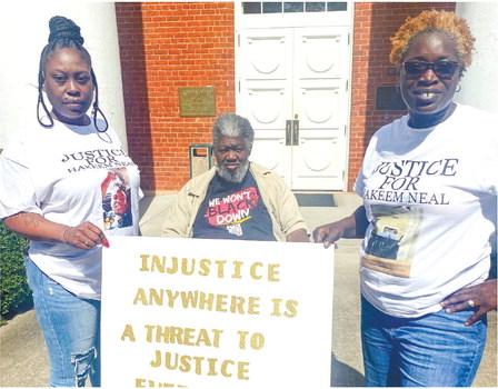 Cierra Porter, Marion Griggs of Black Votes Matter and Amelia Riley stand in front of the Greene County Courthouse. MAUREEN STRATTON/Staff